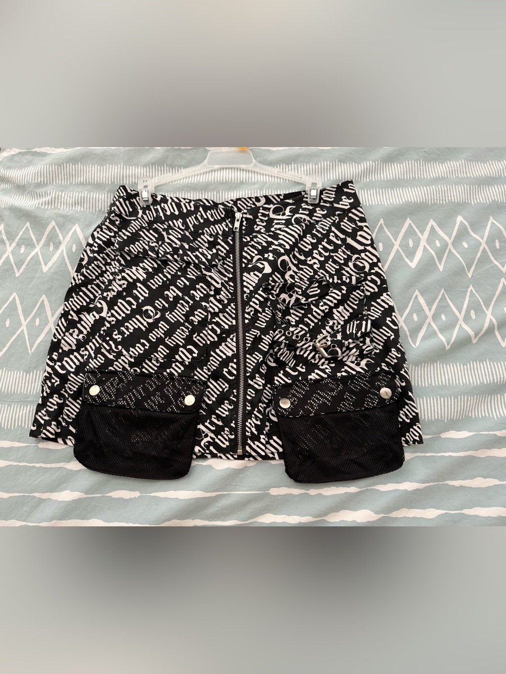 Black & White Script-Print Mini Skirt with Front Zip and Mesh Pockets